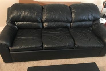 Black leather couch (Downtown Raleigh)