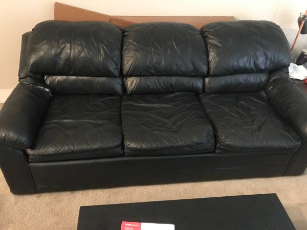 Black leather couch (Downtown Raleigh)