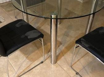 Glass table and four chairs – free (West Palm Beach)