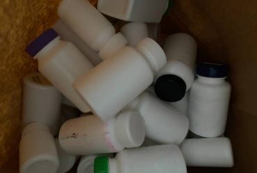 Empty white plastic bottles/ containers (Tamarac)