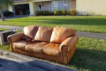 Curb Alert: Moving Free leather couch, nice! Hurricane plywood (Margate)