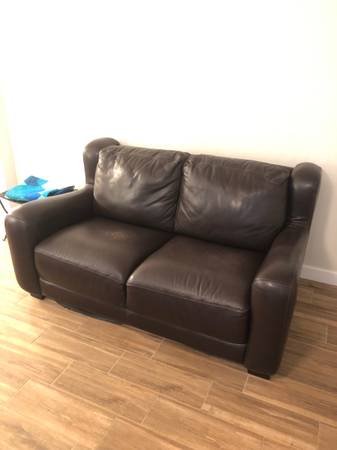 Overstuffed brown leather loveseat sofa