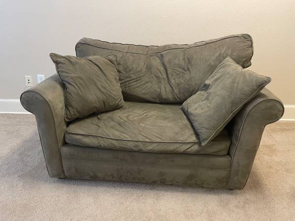 Cushy olive green loveseat, opens to single bed (LBJ & CENTRAL AREA)