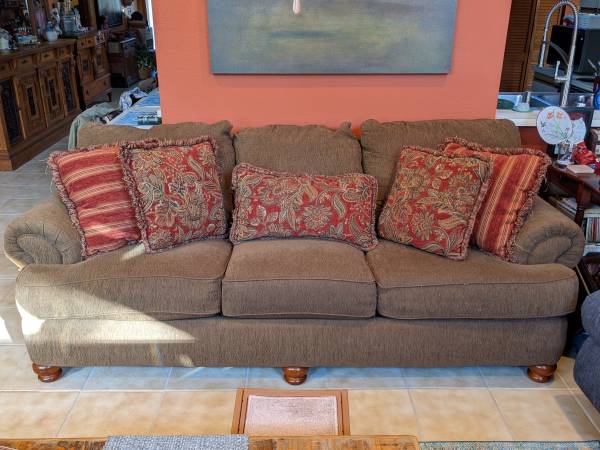 Free sofa , leaning bookcases and large floor lamp