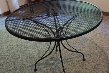 Black wrought iron round table with a glass FREE!